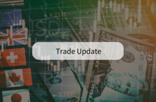 Background of various international flags, US dollar notes, and stock market graphs, with the text Trade Update centred in a white box.