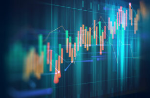 A digital illustration of a financial chart with colourful candlesticks and line graphs, representing stock market or trading data, on a blue-toned abstract background.